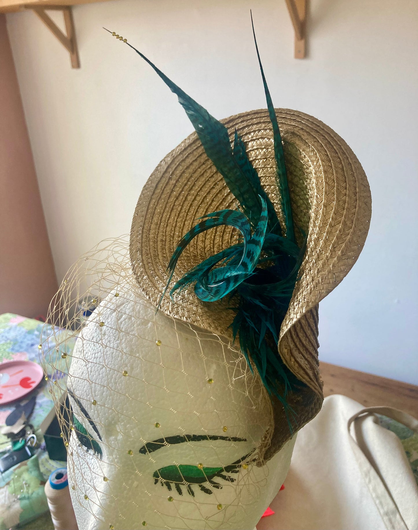 Gold vintage style wedding hat with teal pheasant feathers