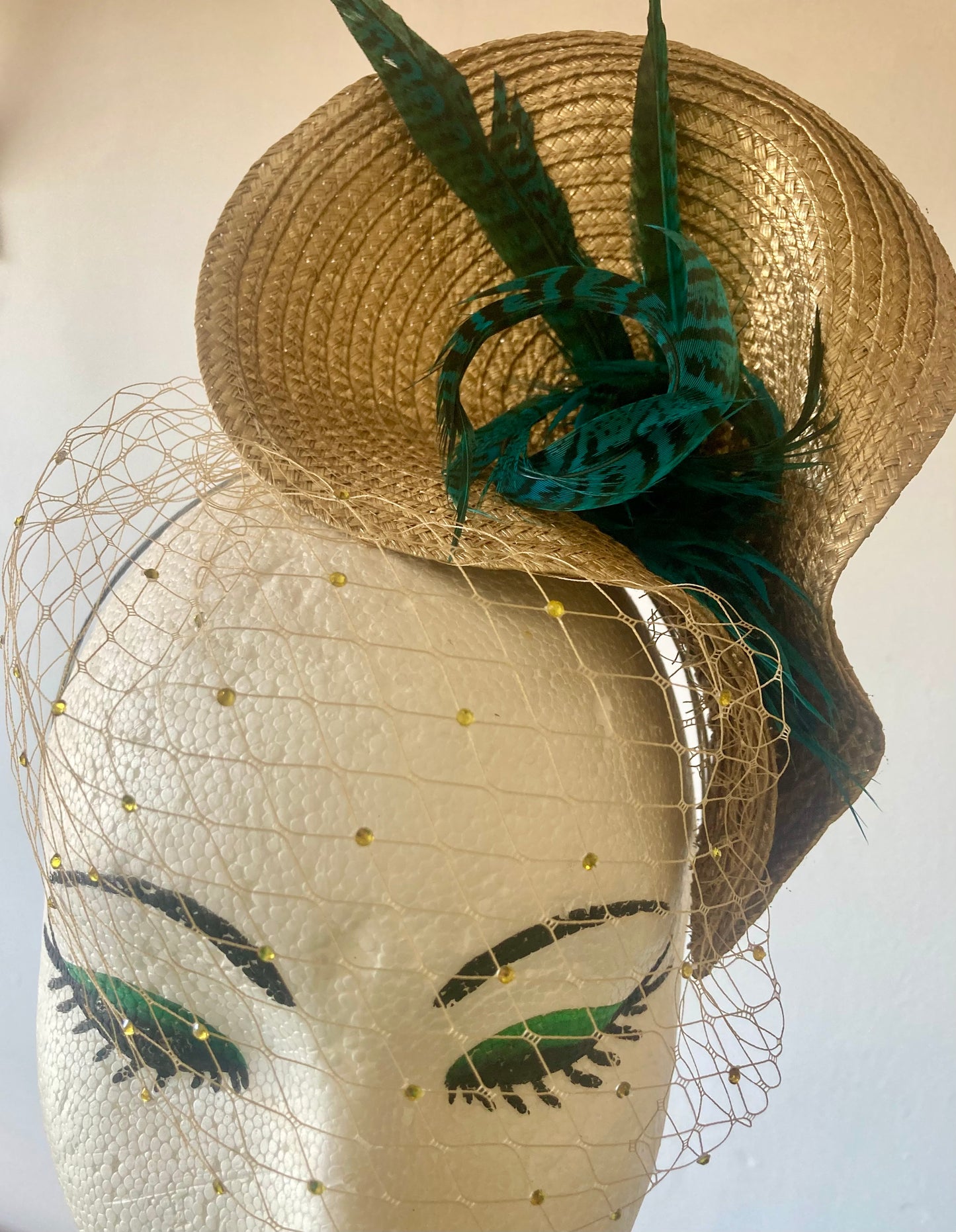 Gold vintage style wedding hat with teal pheasant feathers