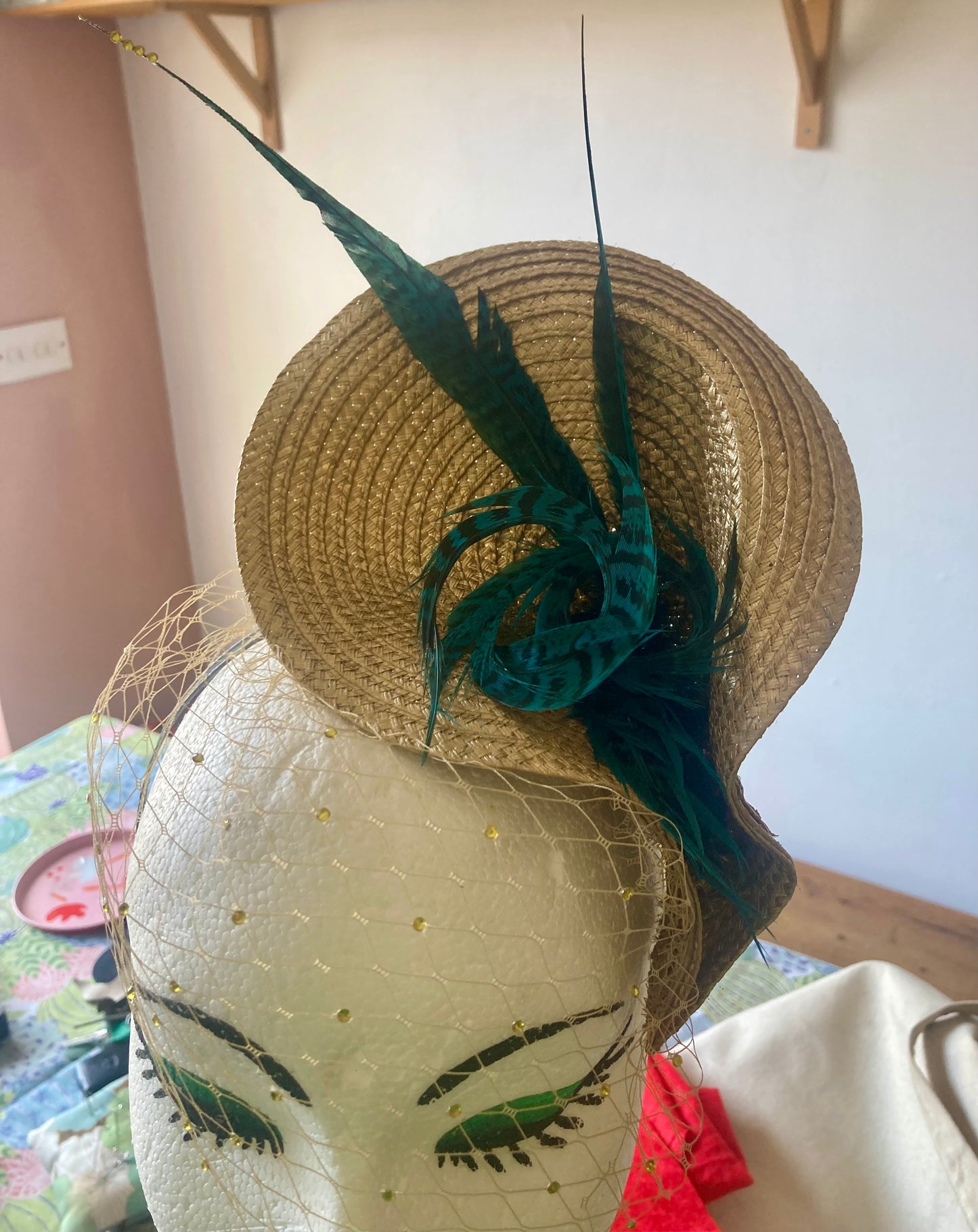 Gold vintage style wedding hat with teal pheasant feathers